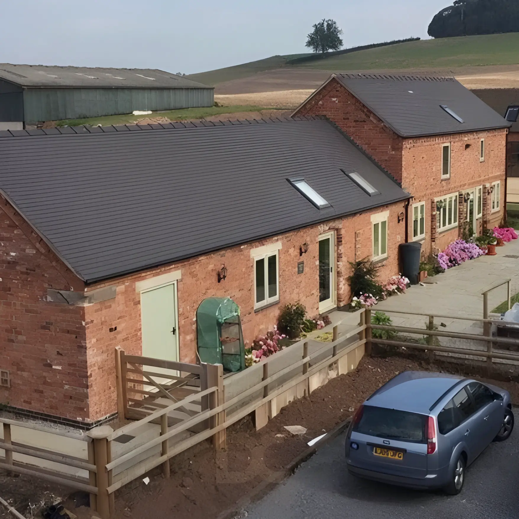 Converted red-brick barn buildings and garage after full renovation in Stafford