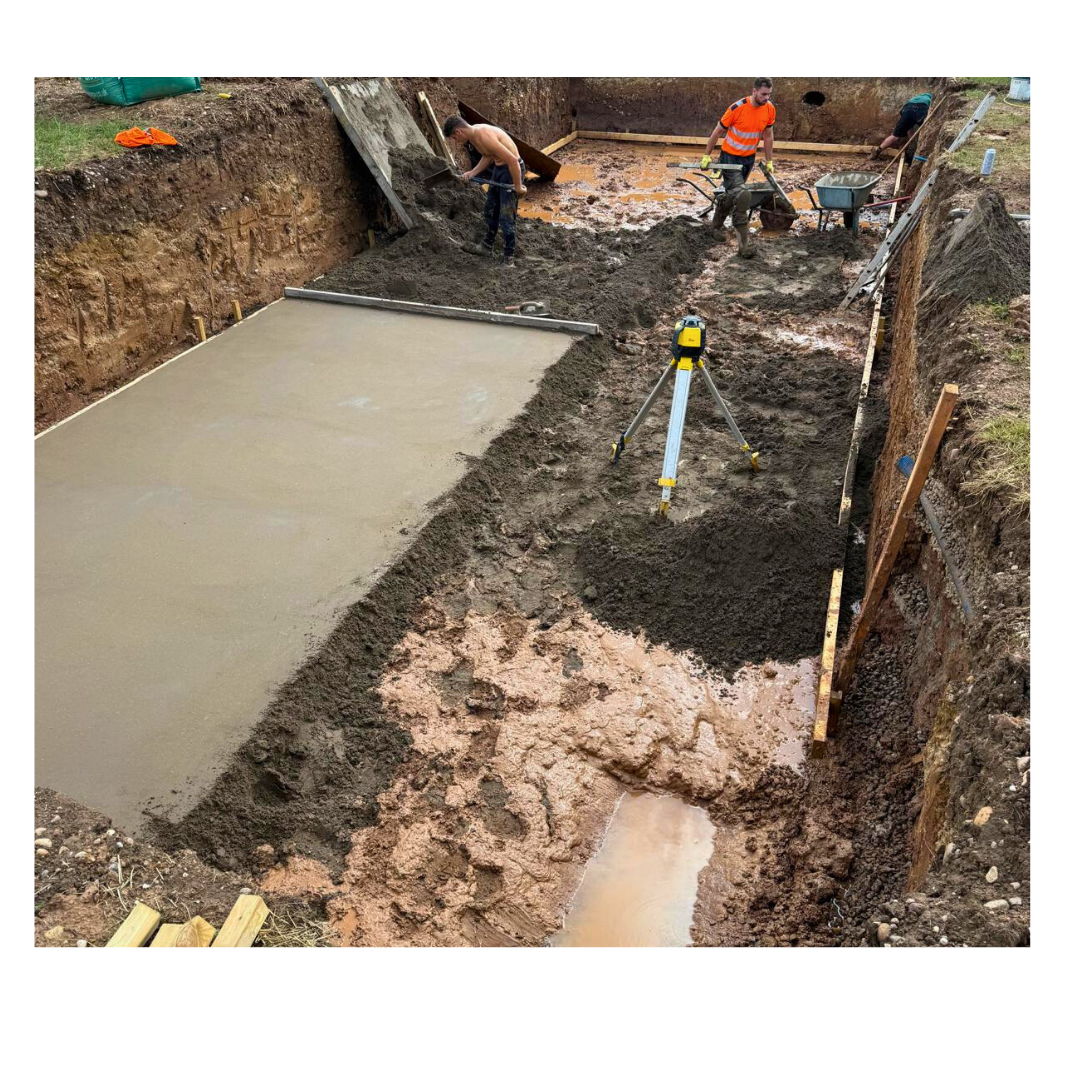 Team laying a 150mm screed base for an outdoor pool in Staffordshire