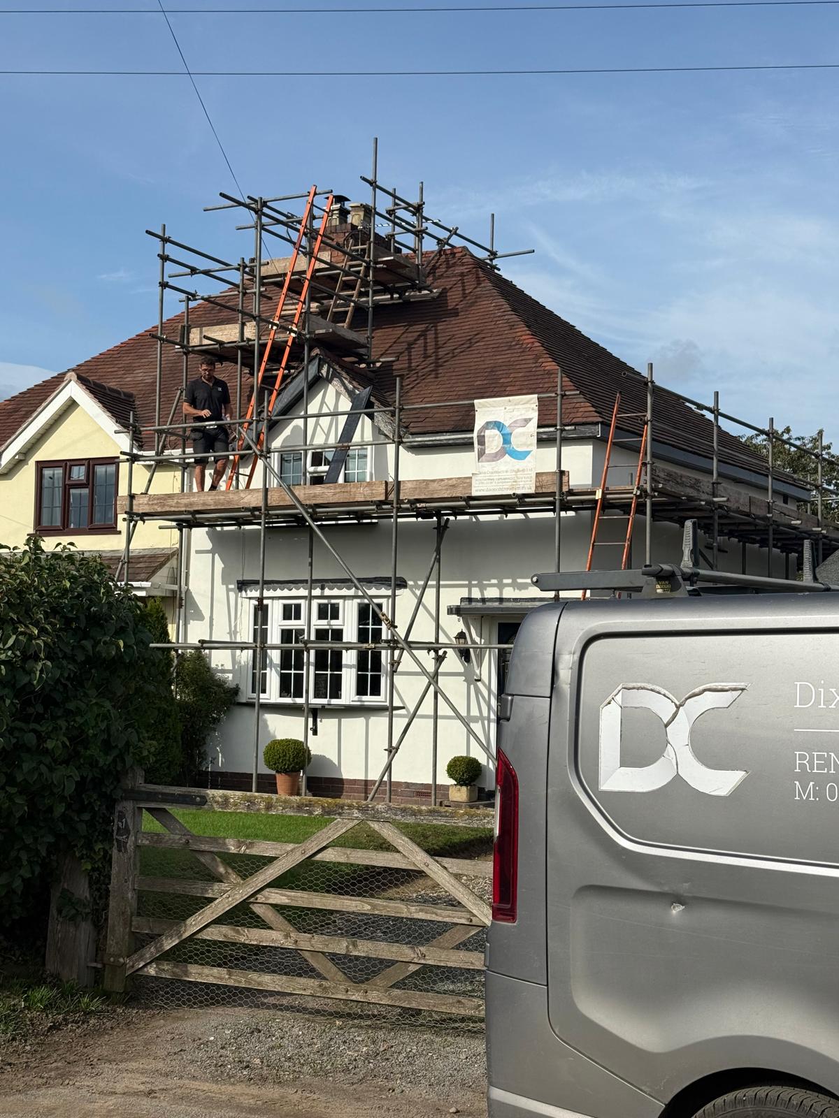 Dixon Construction scaffold and van at a Penkridge cottage during chimney rebuilding works