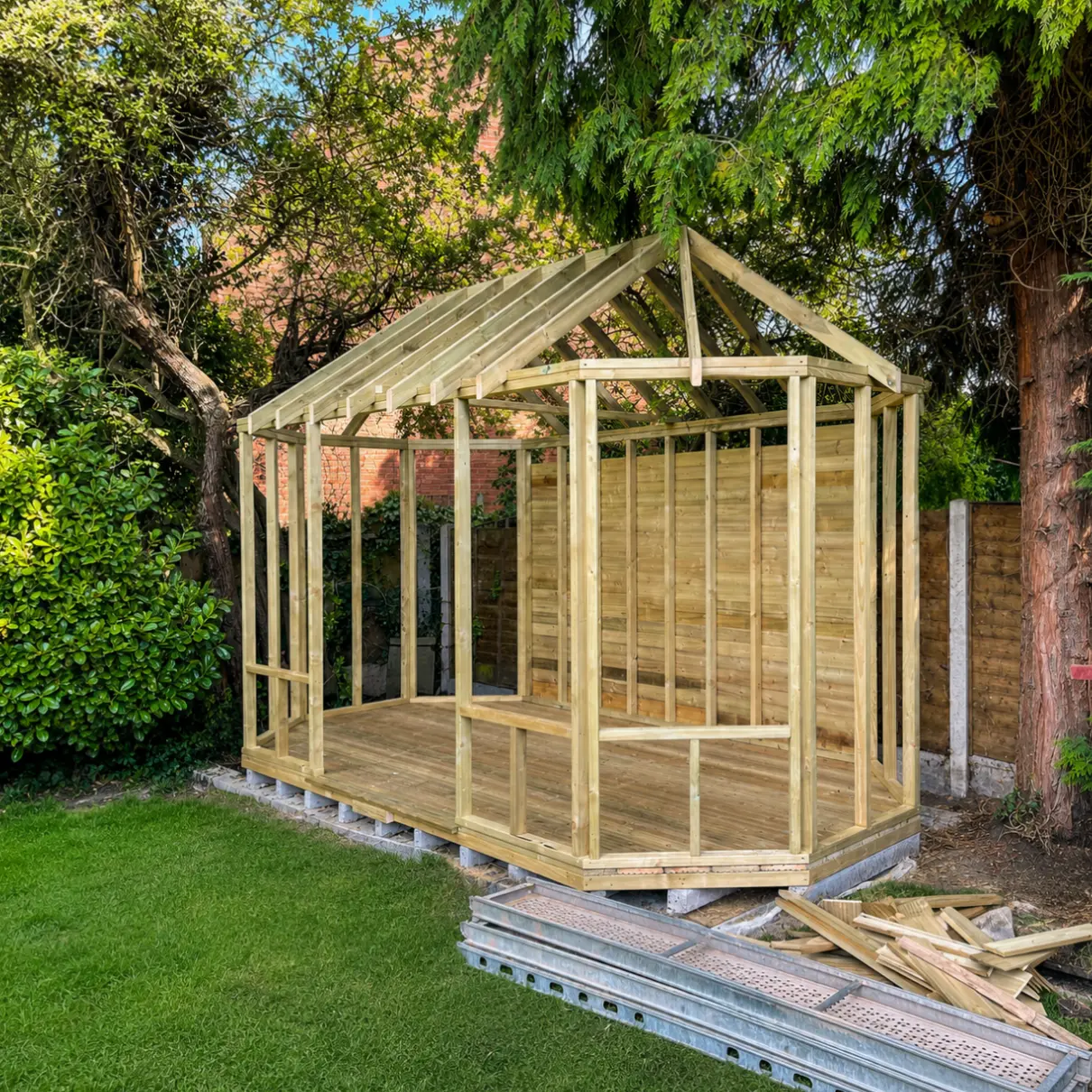 Timber frame and apex roof structure under construction for a garden room in Penkridge