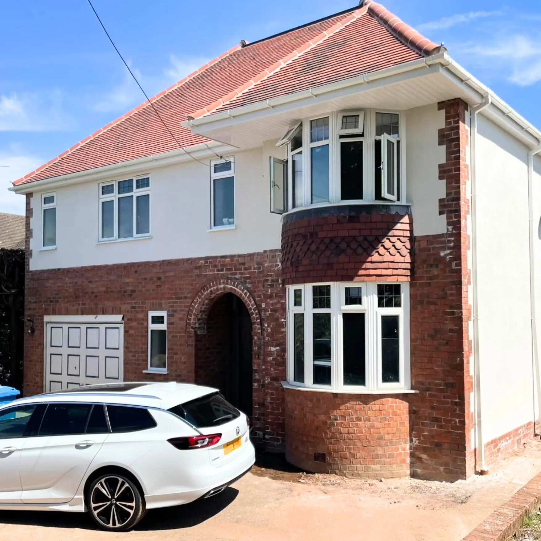 Family home after a loft conversion and full front extension aligned with the garage